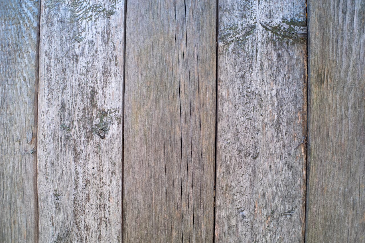 Close-up view of aged wooden planks, ideal for rustic background or texture.