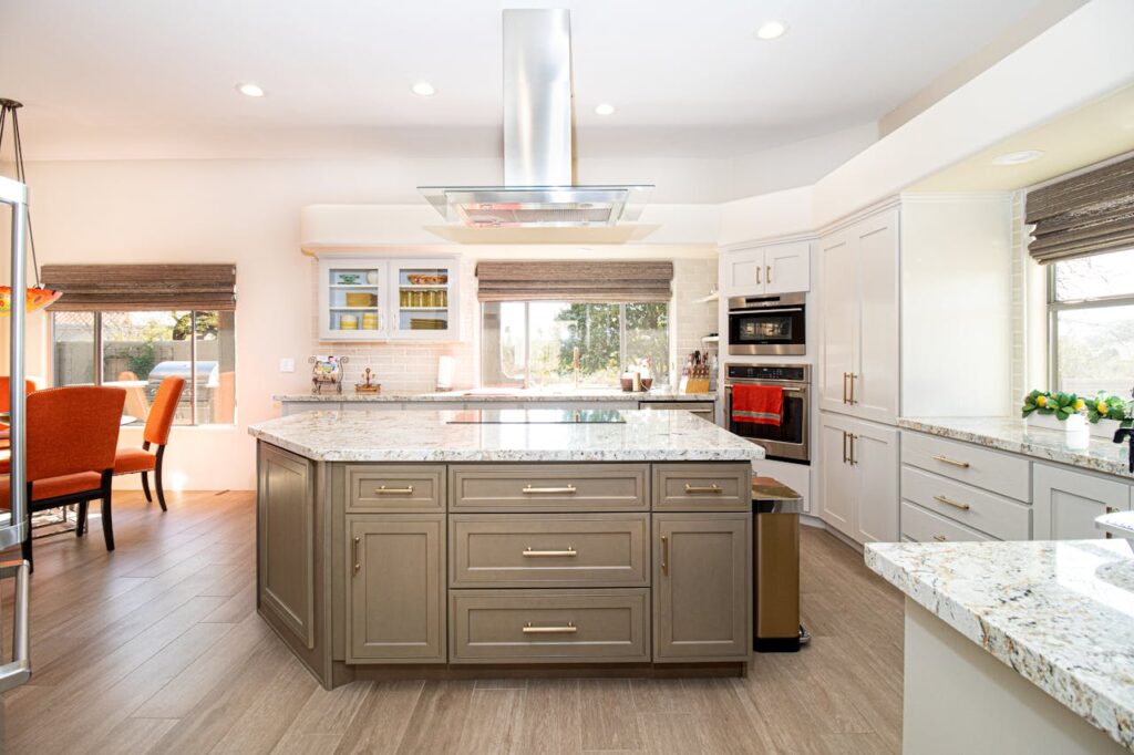 Spacious modern kitchen featuring a center island, stainless steel appliances, and elegant decor.